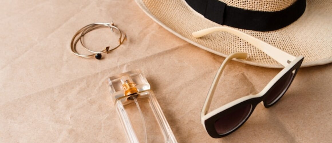 accessories-sunglasses-perfume-hat-craft-surface_176420-11866